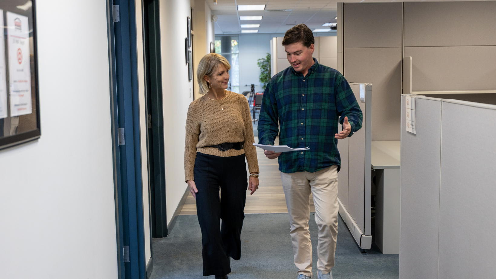 Property management team members reviewing information together in an office